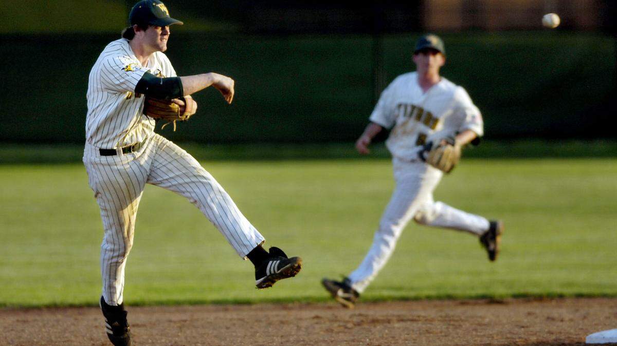 A 2008 photo shows Garrison Lassiter, shortstop for West Forsyth High School, fielding a ground ball and throwing to first base during West’s first-round game of the NCHSAA’s Class 4-A playoffs against Charlotte Providence, held at West Forsyth High School Friday.