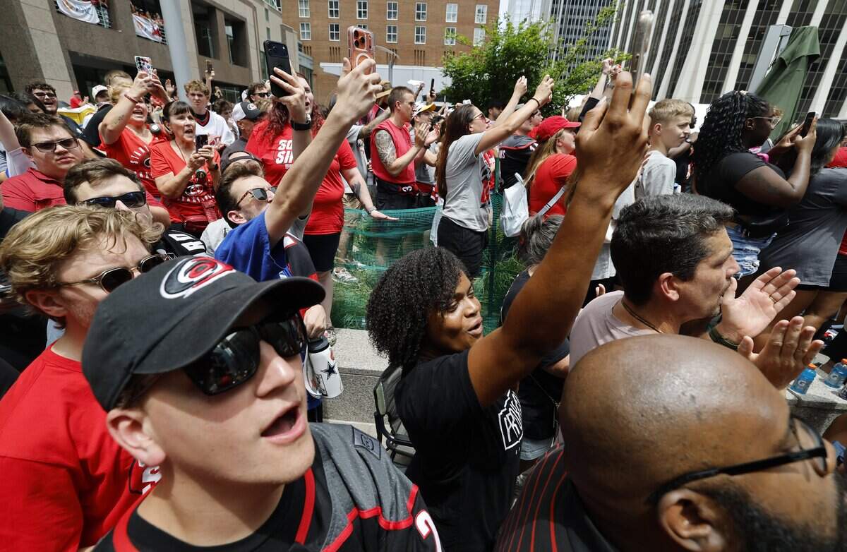 Canes fans watch the rally for the Carolina Hurricanes in downtown Raleigh Saturday, June 20, 2026.