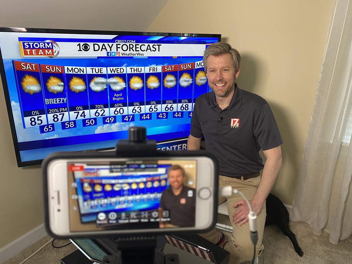 CBS 17 chief meteorologist Wes Hohenstein from his Home Storm Center during the COVID-19 coronavirus pandemic. The Hohenstein family cat, Tigger, can be seen in the background.