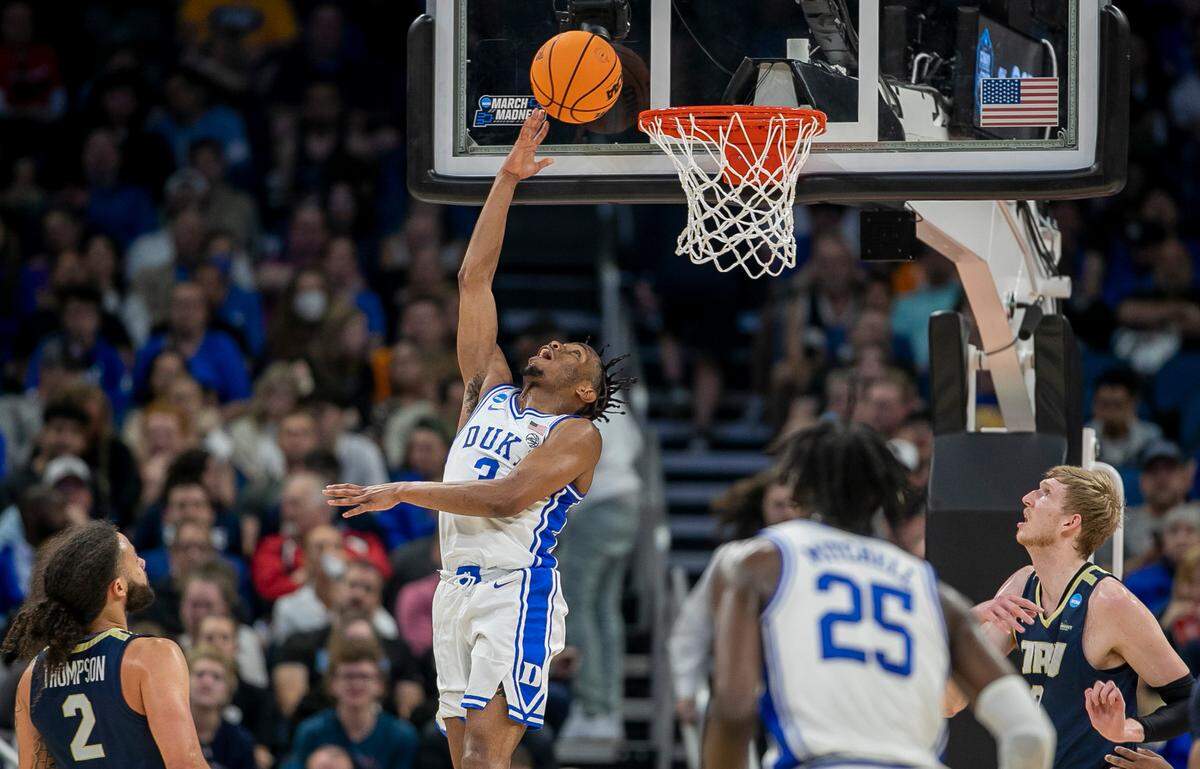 Duke’s Jeremy Roach (3) breaks to the basket for a reverse layup against Oral Roberts’ Connor Vanover (35) in the first half during the first round of the NCAA Tournament on Thursday, March 16, 2023 at the Amway Center in Orlando, Fla.