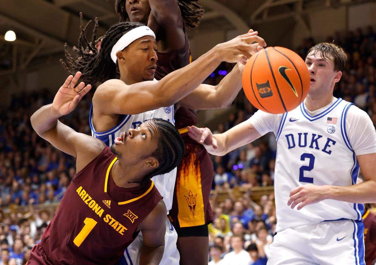 Duke’s Maliq Brown (6) tries to pull in the loose ball in front of Arizona State’s Alston Mason (1) during the first half of Duke’s game against Arizona State in the Brotherhood Run Charity Game at Cameron Indoor Stadium in Durham, N.C., Sunday, Oct. 27, 2024.