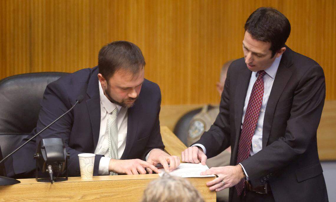 Special Prosecutor Boz Zellinger asks Johnston County school board member Ronald Johnson Jr. to examine a document during his trial at the Johnston County Courthouse in Smithfield, N.C., Thursday, Jan. 16, 2025. Johnson is on trial on criminal charges of extortion, obstruction of justice and willfully failing to discharge his duties.