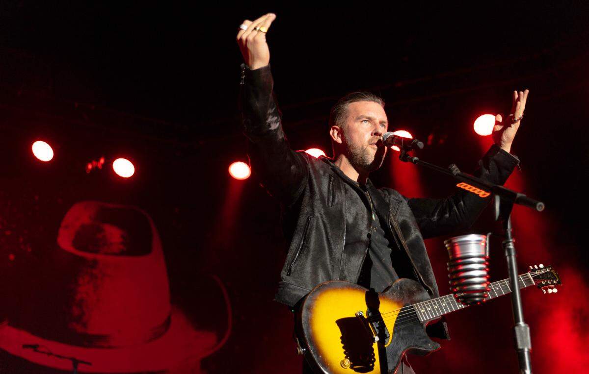 T.J. Osborne encourages the crowd as Brothers Osborne bring their “Might As Well Be Me” tour to Red Hat Amphitheater, Saturday night, June 8, 2024.