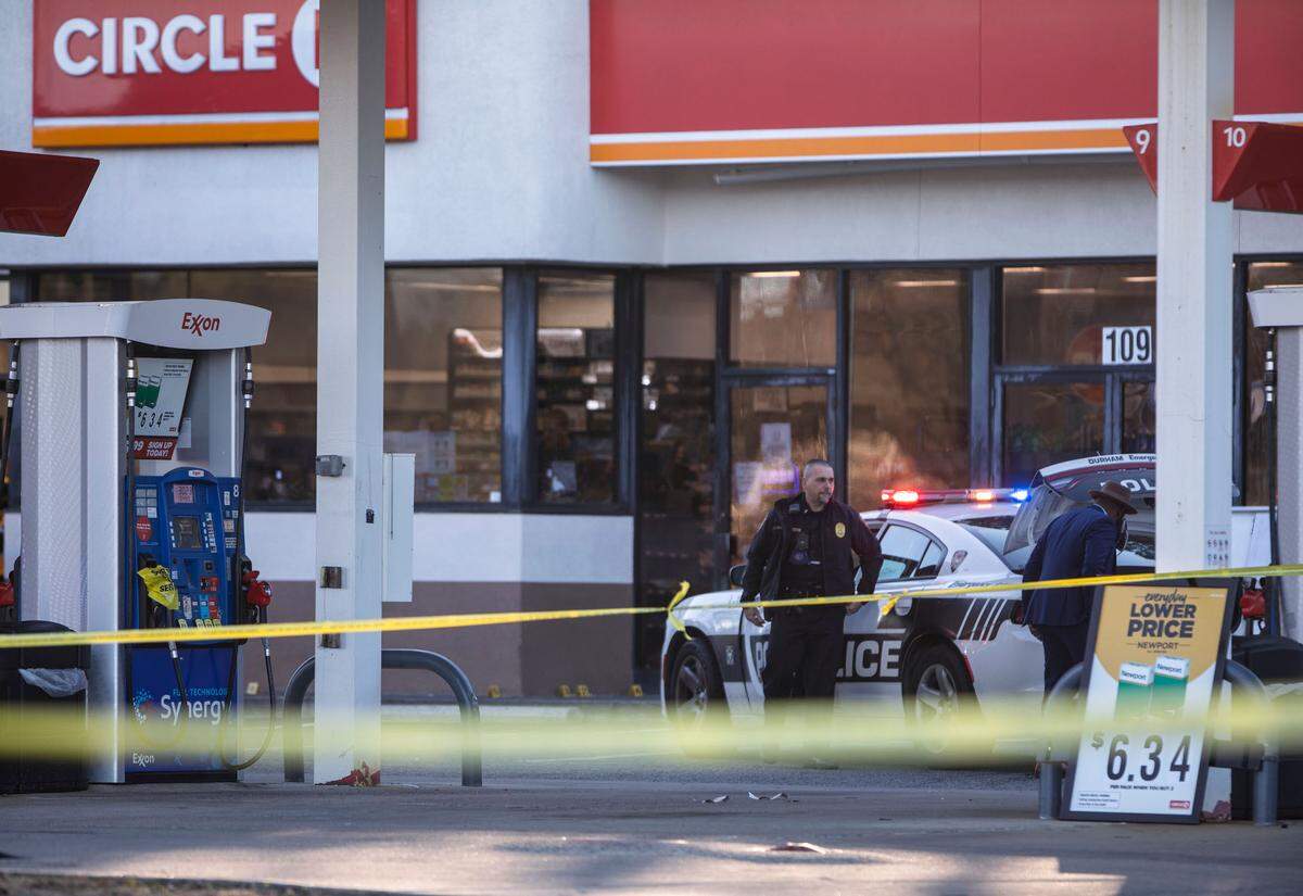Durham police investigate the scene where a man was fatally shot by officers at the Circle K gas station near Fayetteville Road and N.C. Highway 54 on Wednesday, Jan. 12, 2022.