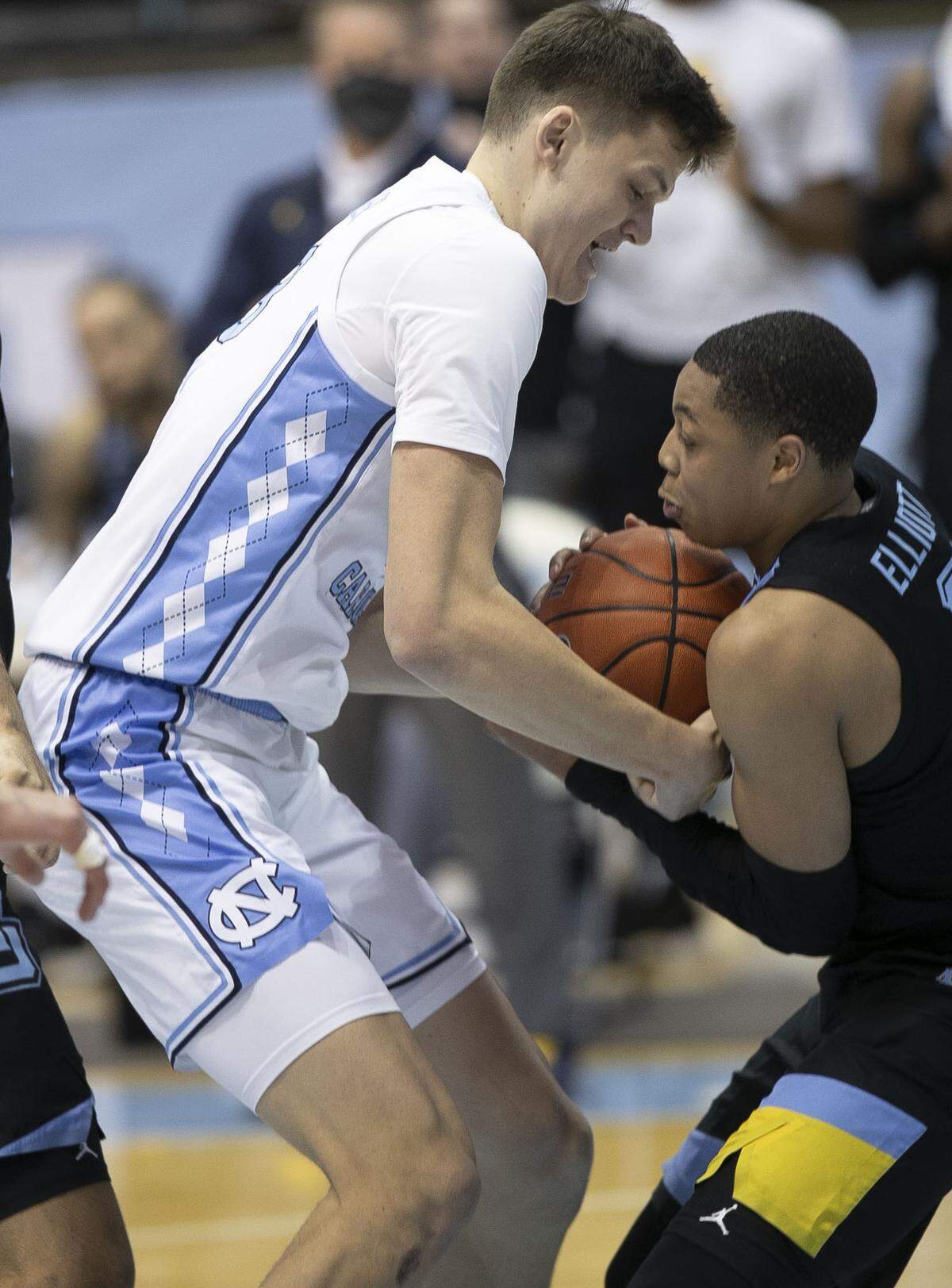 Marquette’s Greg Elliott (5) steals the ball from North Carolina’s Walker Kessler (13) during the first half on Wednesday, February 24, 2021 at the Smith Center in Chapel Hill, N.C.