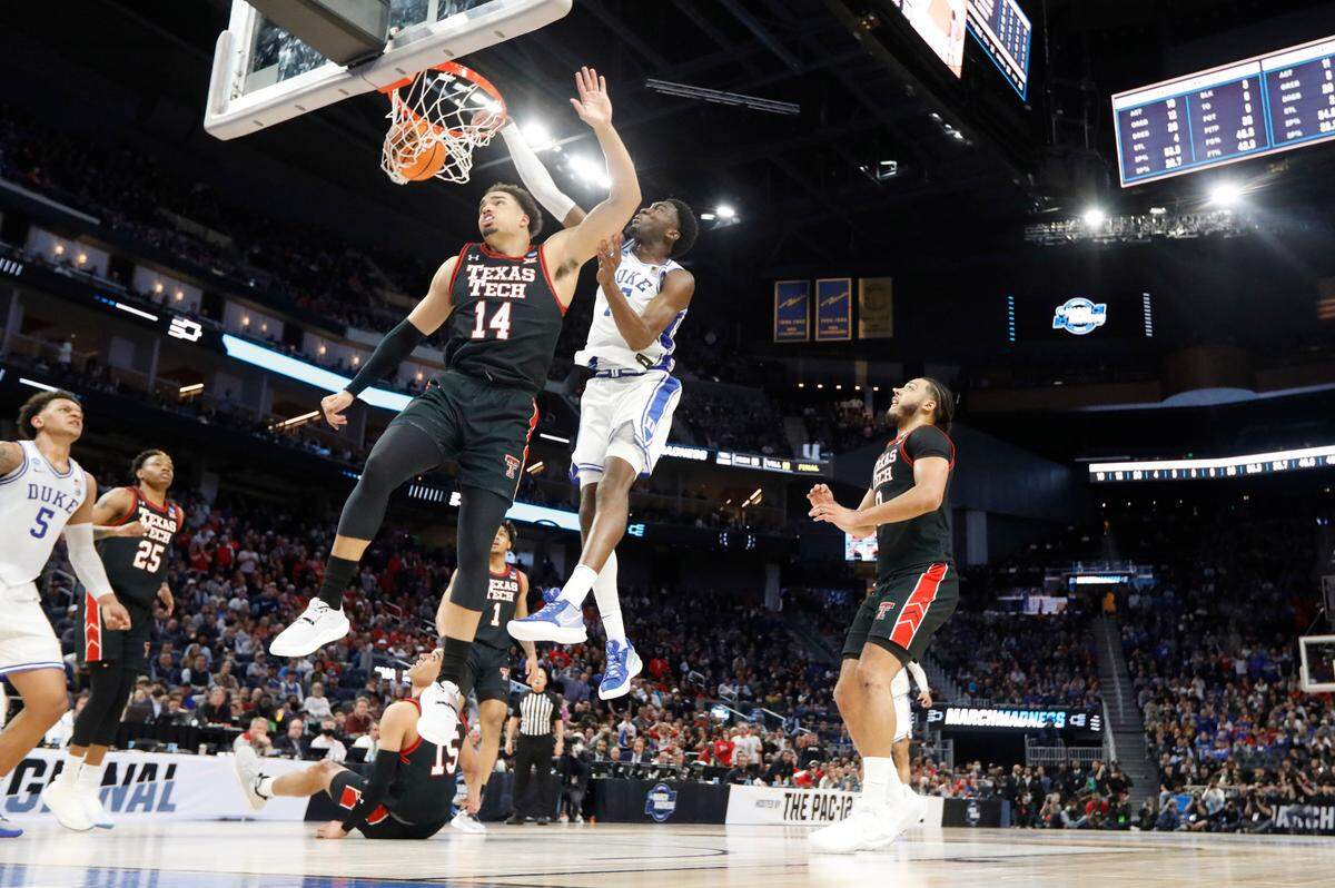 Duke’s Mark Williams (15) slams in two over Texas Tech’s Marcus Santos-Silva (14) during Duke’s 78-73 victory over Texas Tech in the Sweet 16 round of the NCAA Tournament at the Chase Center in San Francisco, Calif., Thursday, March 24, 2022.