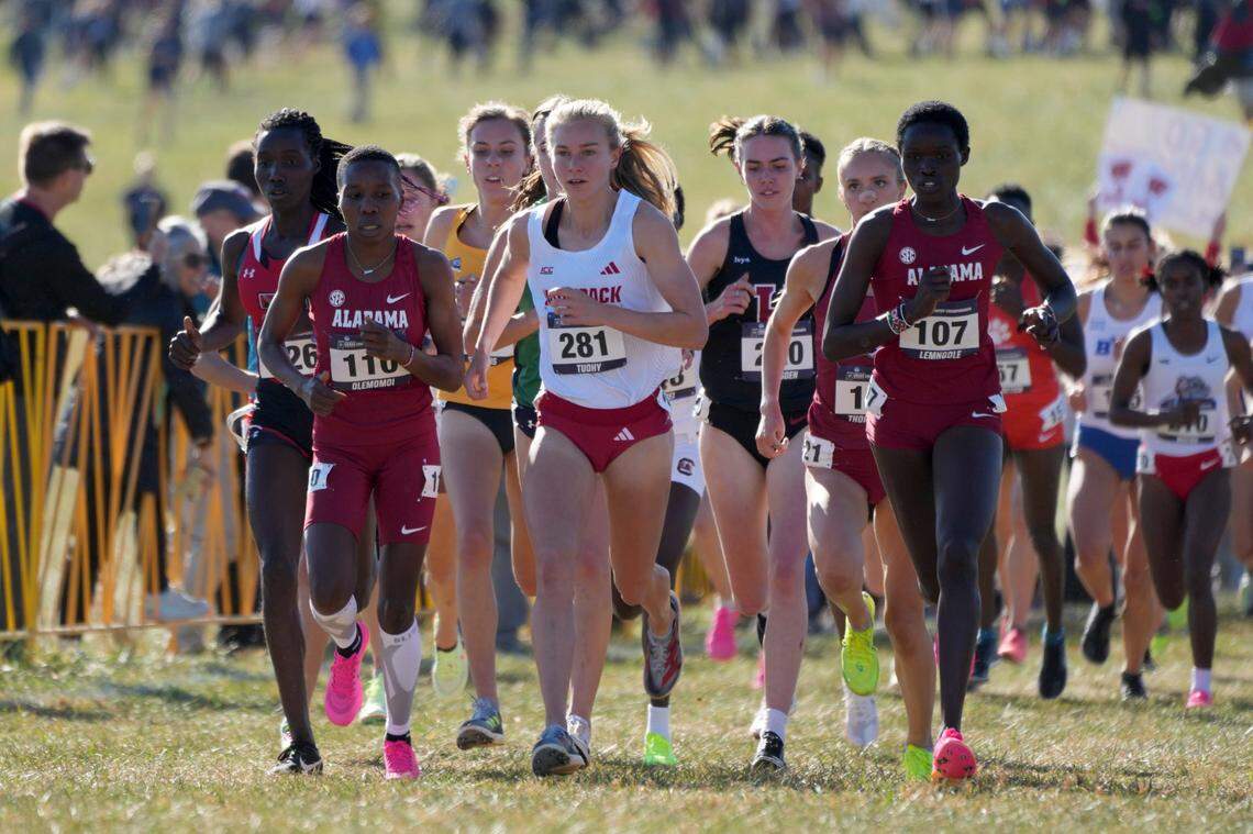 Doris Lemngole (107) and Hilda Olemomoi (110) of Alabama and Katelyn Tuohy of NC State (281) run in the women’s race during the NCAA cross country championships at Panorama Farms.