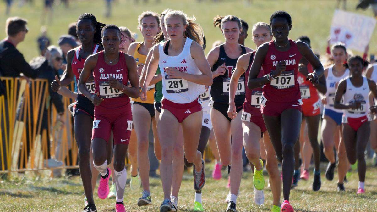 Doris Lemngole (107) and Hilda Olemomoi (110) of Alabama and Katelyn Tuohy of NC State (181) run in the women’s race during the NCAA cross country championships at Panorama Farms.