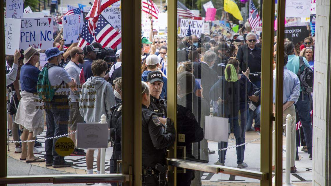 General Assembly Police block the entrance of the North Carolina General Assembly building as ReOpenNC protestors gather in the minutes before the House and the Senate were scheduled to begin their sessions on Tuesday, Apr. 28, 2020, in Raleigh, N.C.