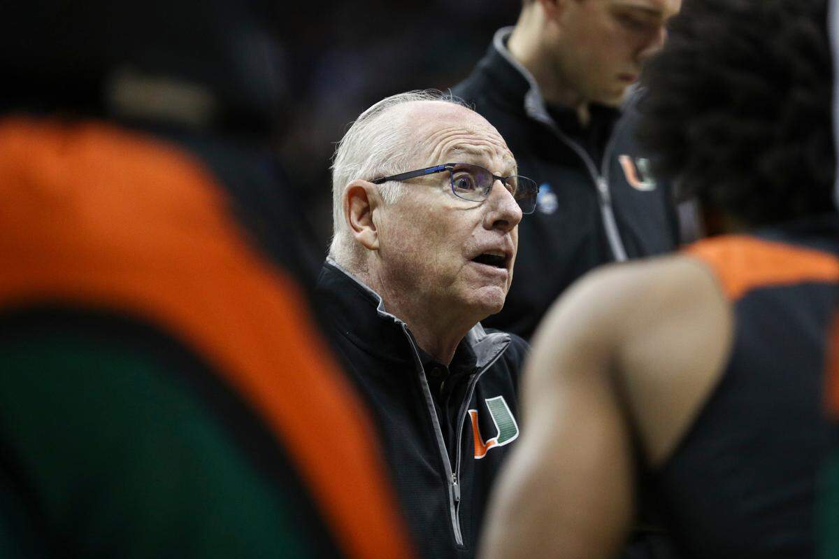 Miami Hurricanes head coach Jim Larranaga talks to his team during a timeout in the first half of an NCAA tournament Midwest Regional semifinal against the Houston Cougars at T-Mobile Center.