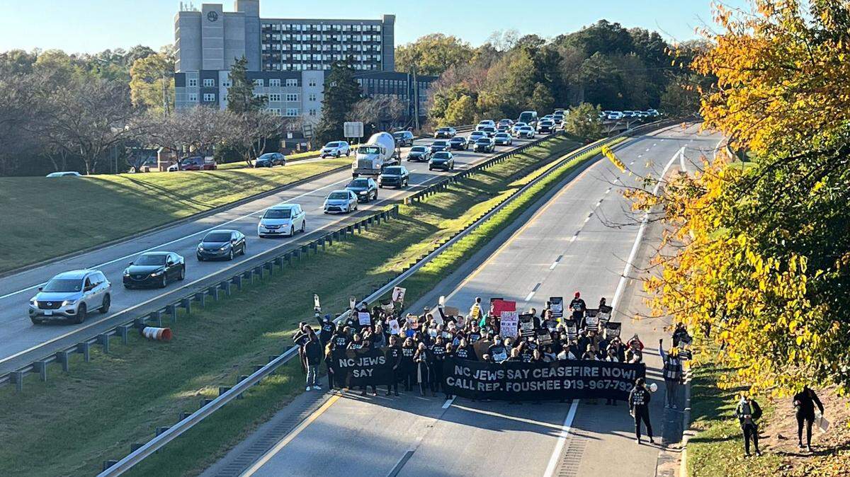 Photos: Anti-war protesters block rush hour traffic on Durham Freeway