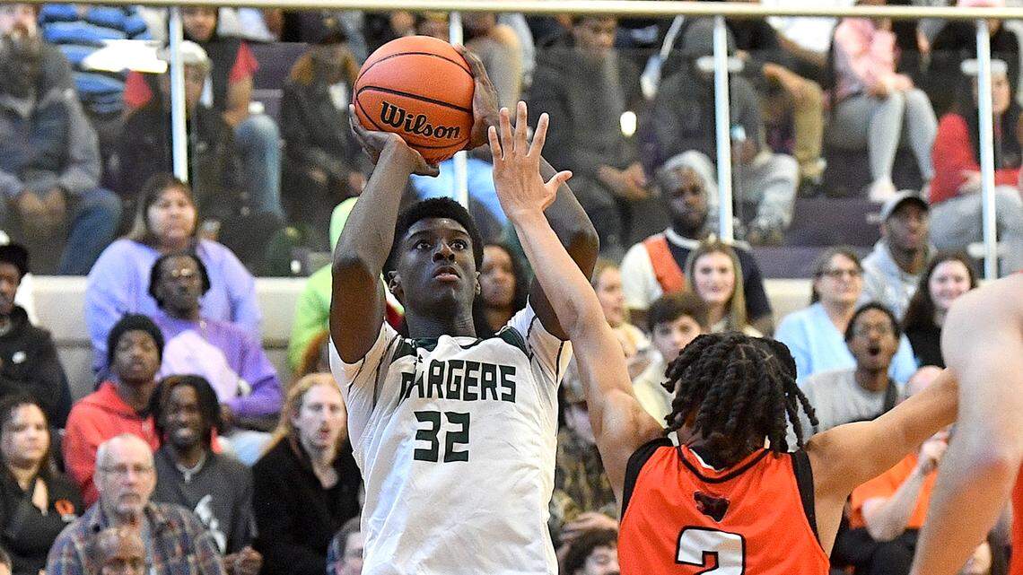 Northwood’s Drake Powell (32) takes the jump shot over Orange’s Freddy Sneed (3) in the first half at the John Wall Holiday Invitational. The Northwood Chargers and the Orange Panthers met in the John Wall Holiday Invitational in Raleigh, N.C. on December 28, 2023.