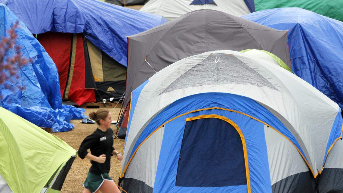 A Duke student runs her laps around the colorful tent city known as Krzyzewskiville in 2012.