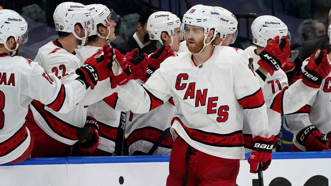 Carolina Hurricanes defenseman Dougie Hamilton (19) celebrates with the bench after his goal against the Tampa Bay Lightning during the second period in Game 4 of an NHL hockey Stanley Cup second-round playoff series Saturday, June 5, 2021, in Tampa.
