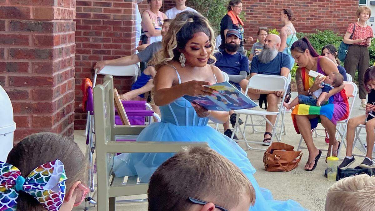 Drag performer Naomi Dix was dressed like a princess as she read Cinderelliot to children at the Pride Festival in Apex, NC.