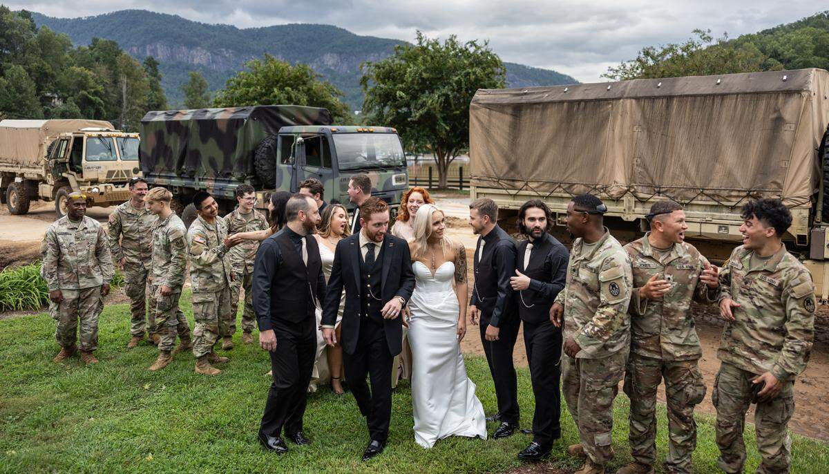 The North Carolina National Guard stops to congratulate the newlyweds, Sereyna and her husband Gavin Walker in Lake Lure, N.C. on Saturday, September 28, 2024.