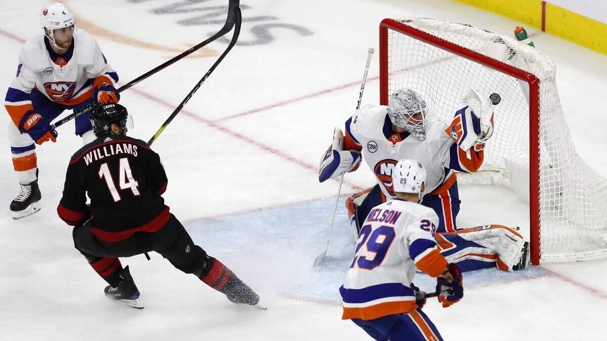 Carolina’s Justin Williams (14) scores the game winning goal on New York’s Robin Lehner (40) during the third period of the Carolina Hurricanes’ 5-2 victory over the New York Islanders at PNC Arena in Raleigh Wednesday, May 1, 2019.