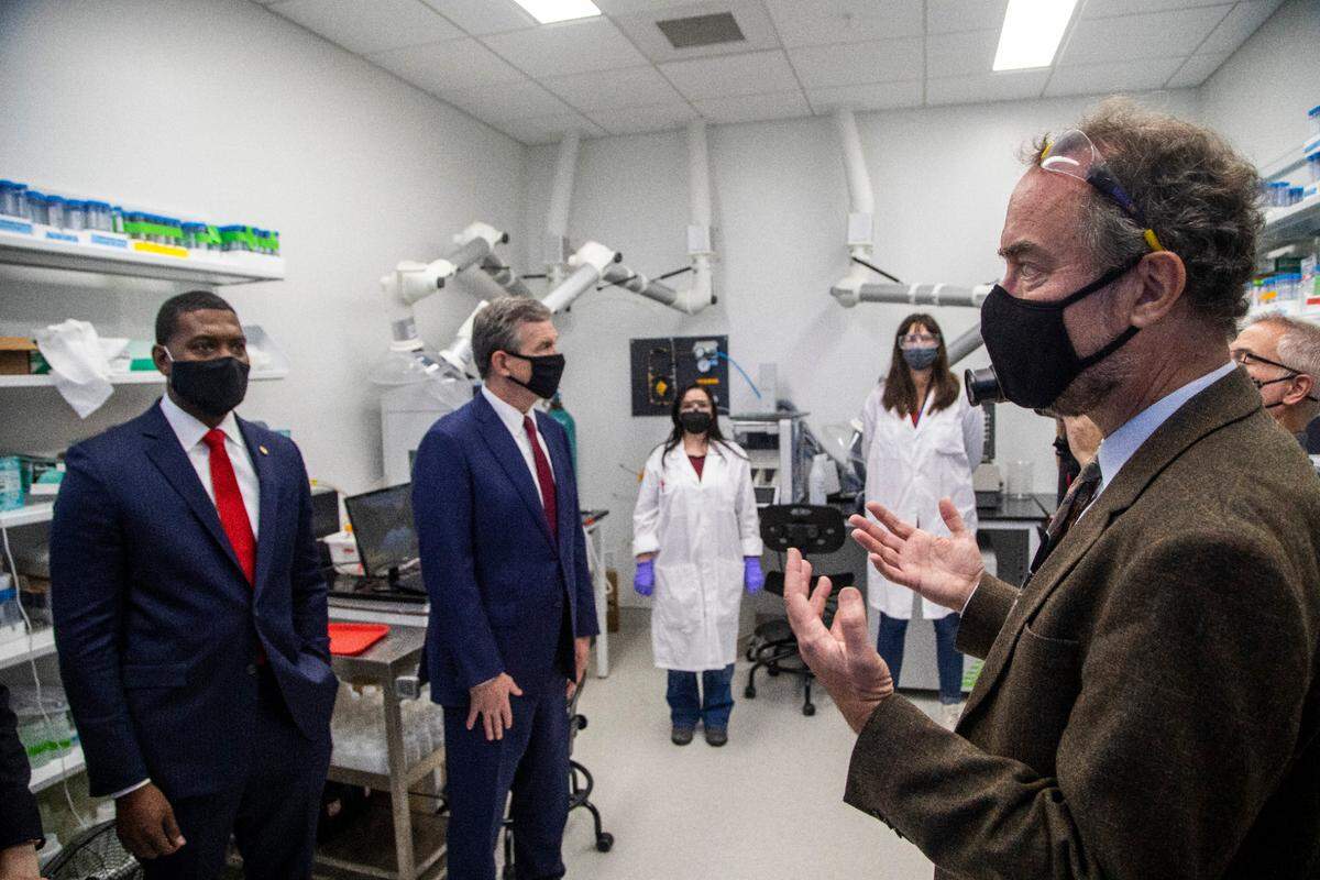 Professor Detlef Knappe, right, leads Environmental Protection Agency Administrator Michael Regan, left, and Gov. Roy Cooper on a tour of a laboratory that tests water samples for “forever chemicals,” or PFAS following an announcement of a Biden administration EPA plan to address PFAS pollution Monday, Oct. 18, 2021, at N.C. State University. The EPA’s PFAS plan sets out to clean up existing contamination, keep additional chemicals from being released, and lead to additional research.