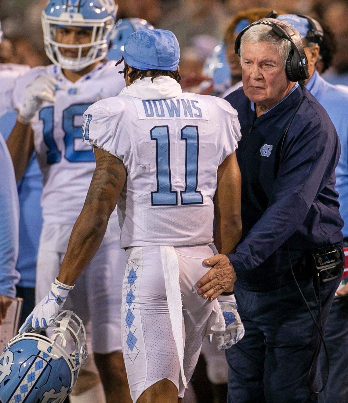 North Carolina coach Mack Brown gives wide receiver Josh Downs (11) a pat on the back after scoring on a 20-yard pass from quarterback Drake Maye to give the Tar Heels a 27-21 lead in the second quarter on Saturday, November 12, 2022 at Truist Field in Winston-Salem, N.C.