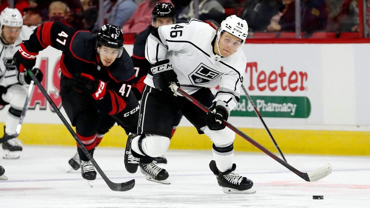 Los Angeles Kings’ Blake Lizotte (46) brings the puck up the ice after taking it away from Carolina Hurricanes’ C.J. Smith (47) during the first period of an NHL hockey game in Raleigh, N.C., Saturday, Dec. 18, 2021. (AP Photo/Karl B DeBlaker)