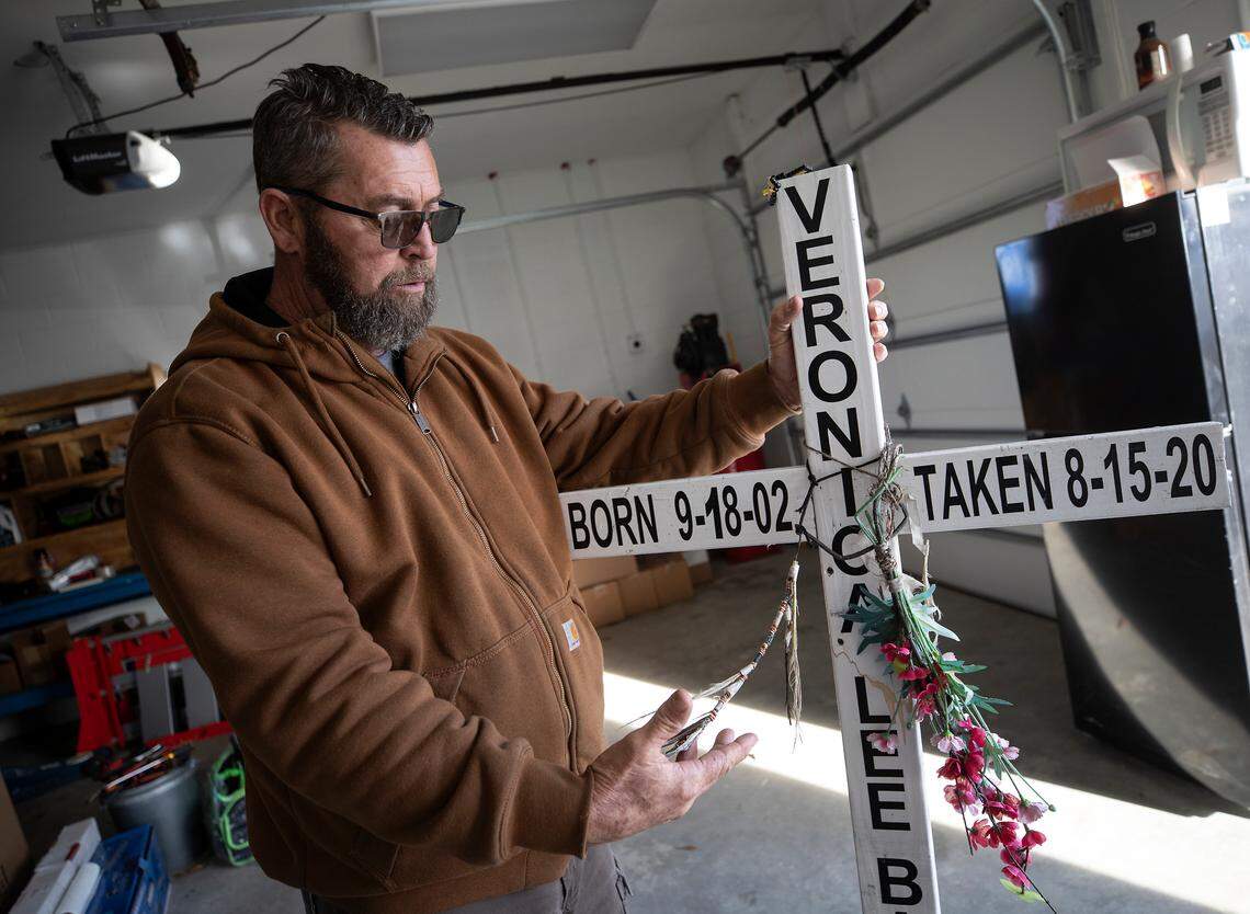 Jim Baker holds a cross he made in honor of his daughter, Veronica Baker, on Friday, Jan. 20, 2023, in Garner, N.C.