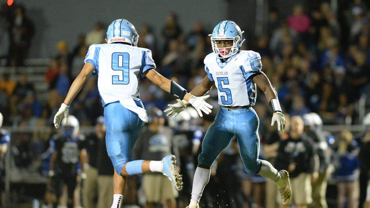 Jacquez Durham (5) and Nick Roccia (9) of Cleveland celebrate during the second half. The Cleveland Rams visited the Clayton Comets in a high school football game on October 25, 2019.