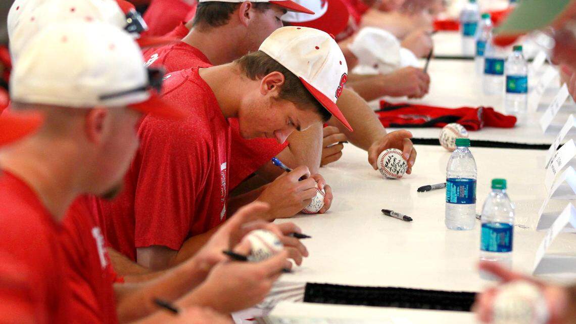 A 2013 photo shows N.C. StateÕs Trea Turner, center, and teammates sign autographs during a team autograph session, part of the Opening Celebration Day of the College World Series at TD Ameritrade Park in Omaha, Nebraska, Friday, June 14, 2013.