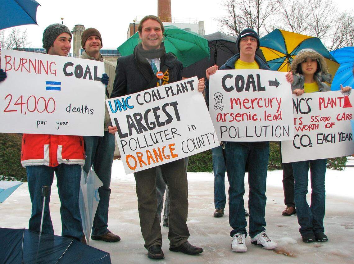 L-R (front row): Eric Ellisberg and Ben Harrison, both of Environment North Carolina, freshman Marshall Wood and freshman Andrea Brandt demonstrate against the UNC-Chapel Hill power plant’s burning coal in February 2010.