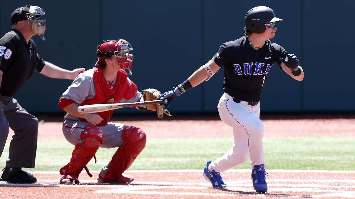 Duke's Griffin Conine follows through after connecting with the ball during the Blue Devils' game with N.C. State at Jack Coombs Field in Durham Saturday, April 21, 2018.