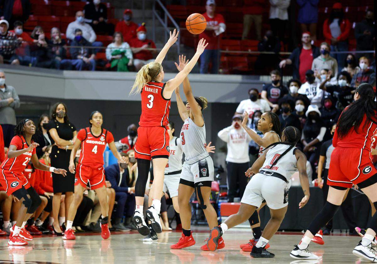 Georgia’s Sarah Ashlee Barker (3) makes a three-pointer with .4 seconds left in regulation to tie the game during Georgia’s 82-80 overtime victory over N.C. State at Reynolds Coliseum in Raleigh, N.C., December 16, 2021.