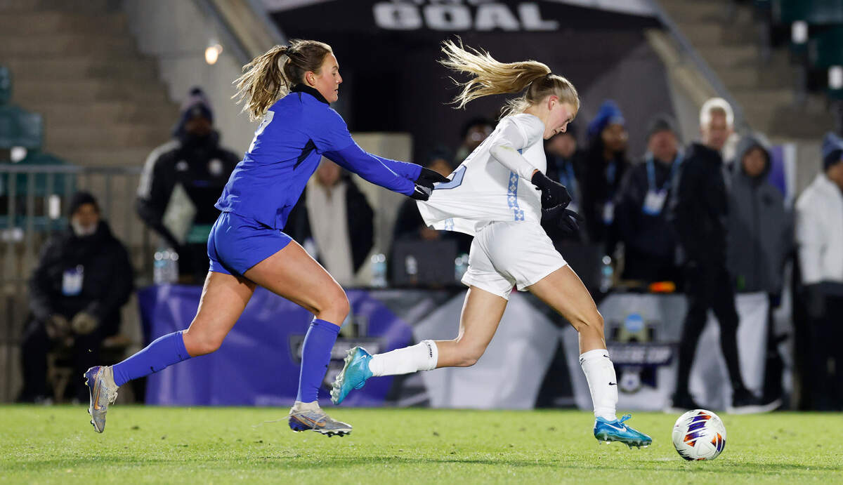 Duke’s Cameron Roller (7) tries to slow down North Carolina’s Maddie Dahlien (5) during the second half of UNC’s 3-0 victory over Duke in the semifinals of the 2024 Women’s College Cup at WakeMed Soccer Park in Cary, N.C., Friday, Dec. 6, 2024. Roller received a yellow card on the play.