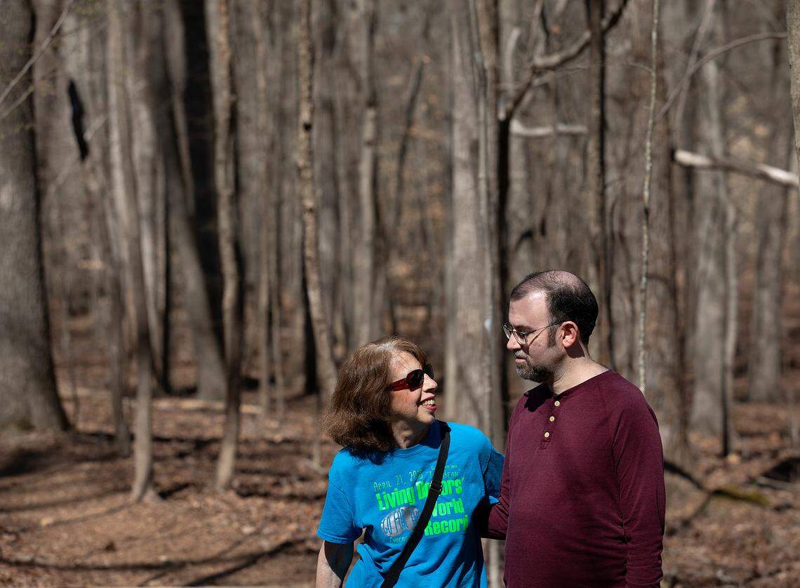 Carol Offen and her son, Paul Offen, pose for a portrait on a trail in the North Carolina Botanical Garden on Wednesday, March 13, 2024, in Chapel Hill, N.C. Carol, who gave Paul a kidney 17 years ago, now advocates for legislation that would offer better protections for live donors.