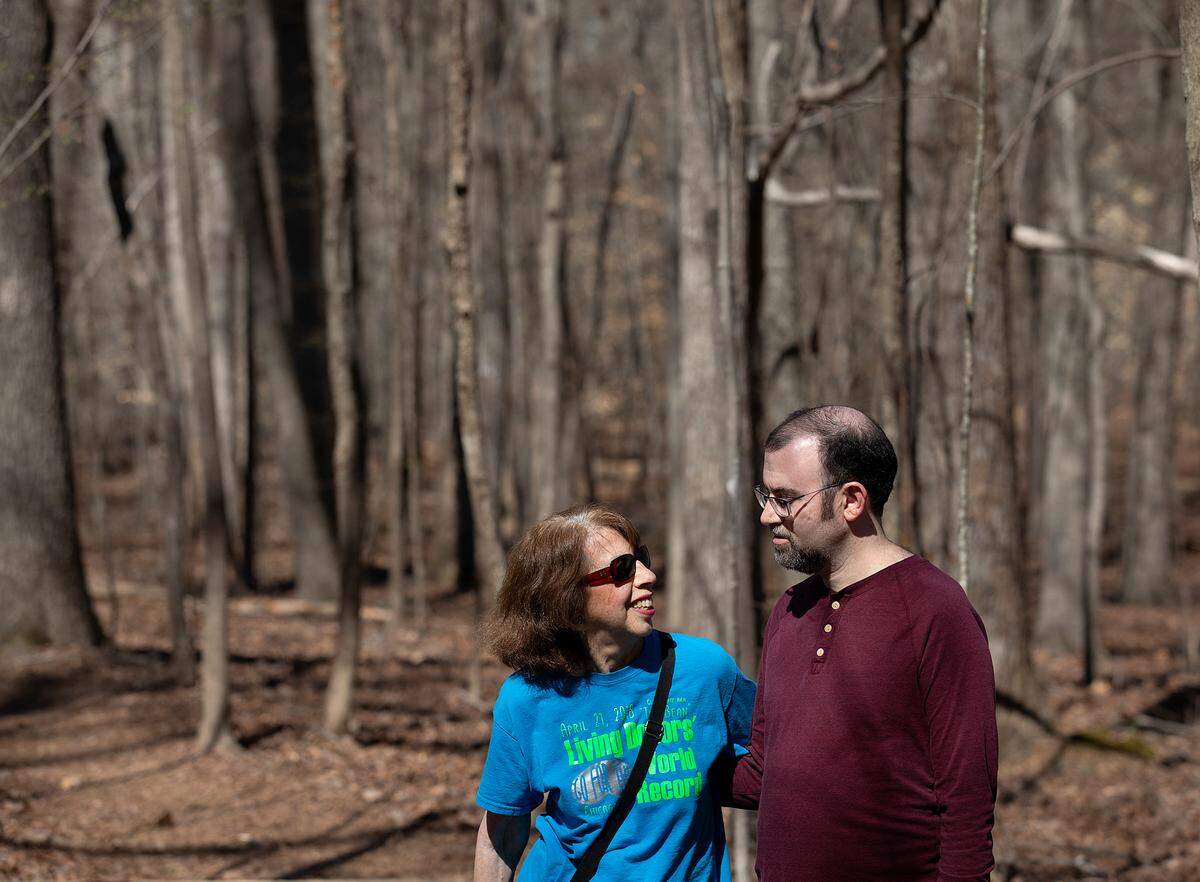 Carol Offen and her son, Paul Offen, pose for a portrait on a trail in the North Carolina Botanical Garden on Wednesday, March 13, 2024, in Chapel Hill, N.C. Carol, who gave Paul a kidney 17 years ago, now advocates for legislation that would offer better protections for live donors.