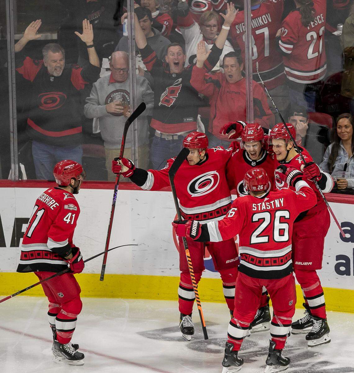 The Carolina Hurricanes Shayne Gostisbehere (41), Jack Drury (18) Jesse Piljujarvi (13) and Paul Stastny (26) congratulate Jesperi Kotkaniemi (82) after he scored the first of two goals against the New Jersey Devils goalie Akira Schmid (40) in the second period during Game 2 of their second round Stanley Cup playoff series on Friday, May 5, 2023 at PNC Arena in Raleigh, N.C.