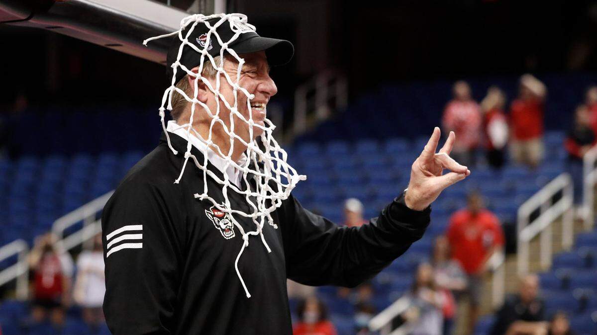 N.C. State head coach Wes Moore celebrates after cutting down the net after the Wolfpacks 60-47 victory over Miami to win the ACC womens basketball tournament in Greensboro, N.C., Sunday, March 6, 2022.