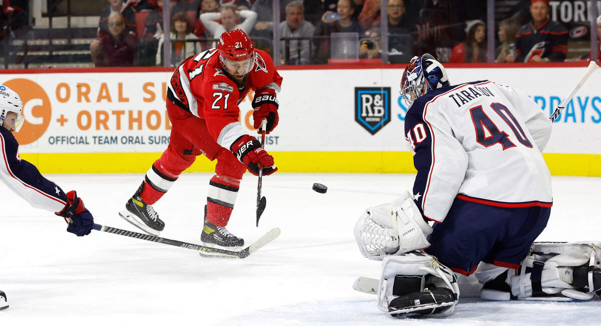 Carolina center Derek Stepan (21) shoots against Columbus goaltender Daniil Tarasov (40) during the second period of the Carolina Hurricanes game against the Columbus Blue Jackets at PNC Arena in Raleigh, N.C., Wednesday, Oct. 12, 2022.
