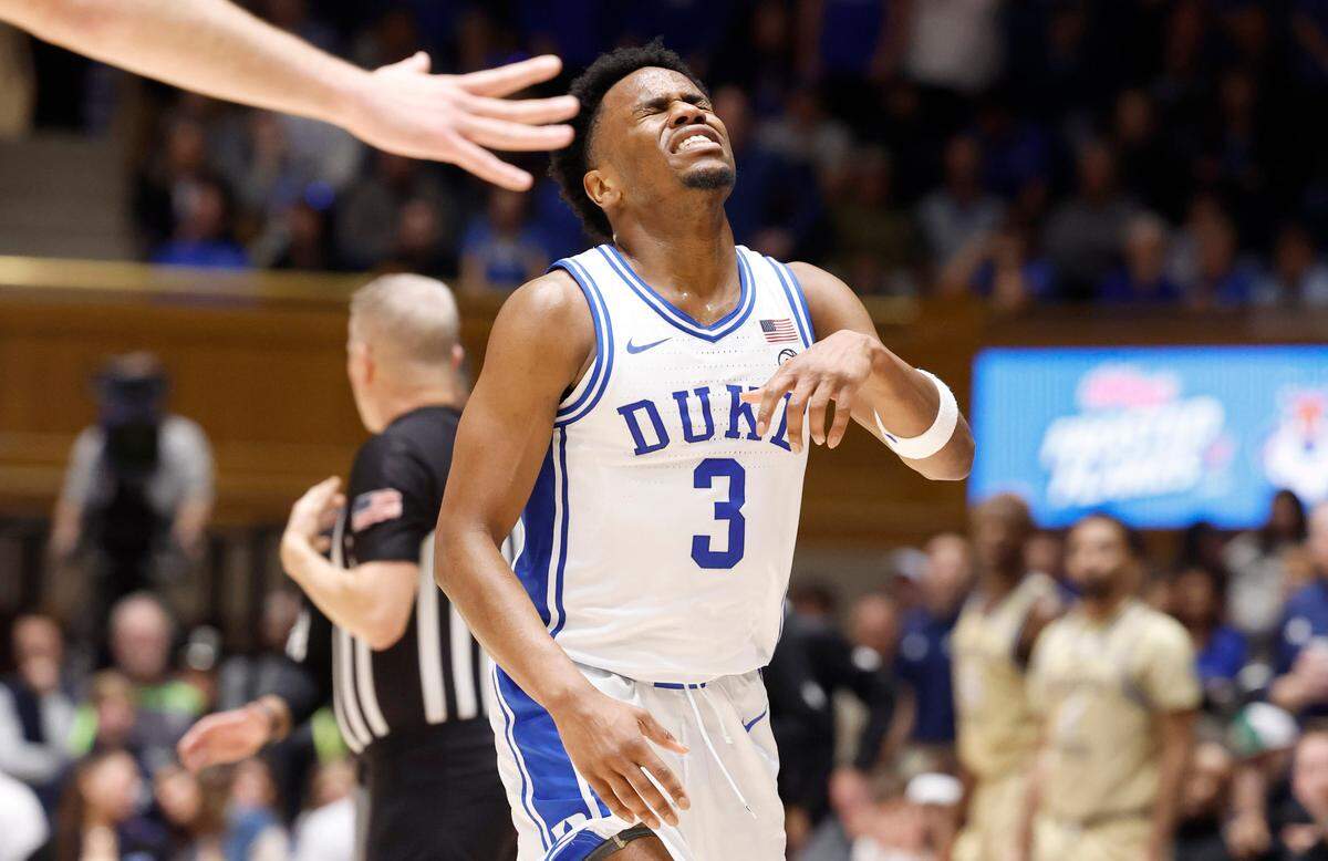 Duke’s Jeremy Roach (3) winces in pain as he comes off the floor after being injured during the second half of Duke’s 84-79 victory over Georgia Tech at Cameron Indoor Stadium in Durham, N.C., Saturday, Jan. 13, 2024.