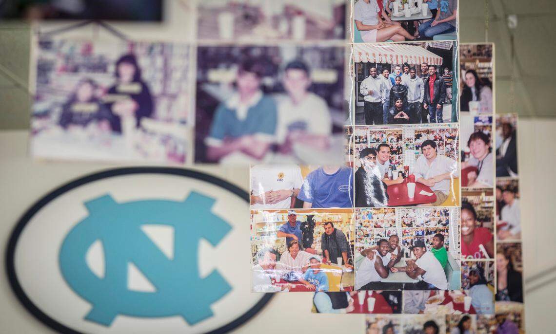 Years and years worth of photographs of Sutton’s Drug Store patrons, some of which are pictured here on Thursday, Aug. 27, 2020, can be seen throughout the Chapel Hill, N.C. staple that sits on Franklin Street.
