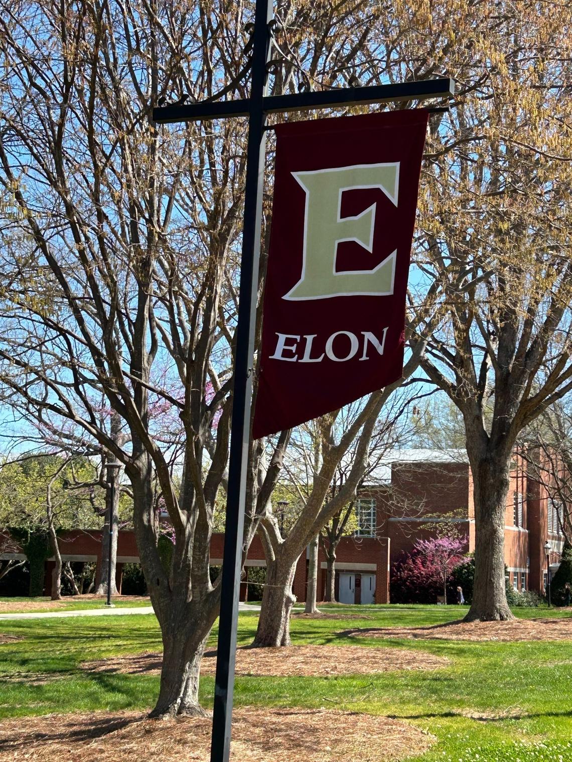 Flags announcing “Elon” line the streets around Elon University. Elon Musk has no connection to the school.