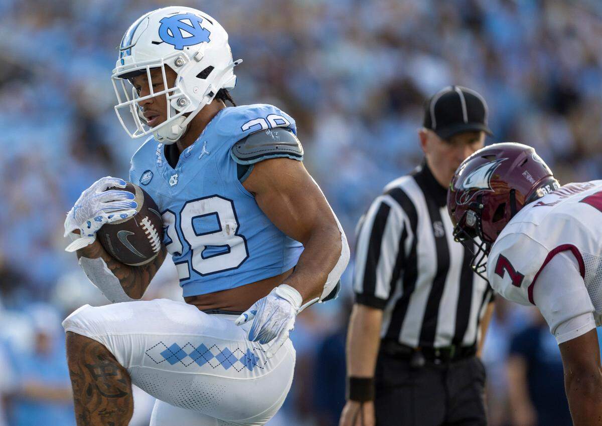 North Carolina running back Omarion Hampton (28) scores a touchdown on an11-yard run in the second quarter ahead of North Carolina Central’s Kole Jones (7) on Saturday, September 14, 2024 at Kenan Stadium in Chapel Hill, N.C.