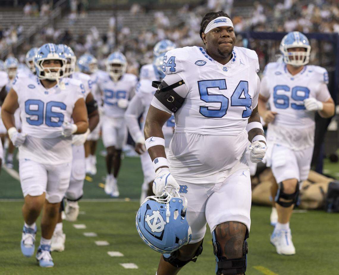 North Carolina offensive lineman Mike McVay (54) leaves the field with his teammates following pre-game warm ups on Saturday, September 6, 2025 at Jerry Richardson Stadium in Charlotte, N.C. 