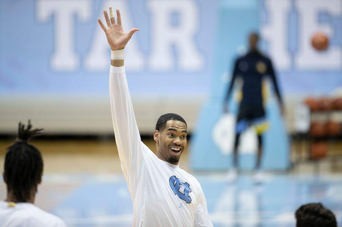North Carolina’s Garrison Brooks (15) reacts after sinking a three-point basket prior to the Tar Heels’ game against Marquette on Wednesday, February 24, 2021 at the Smith Center in Chapel Hill, N.C.