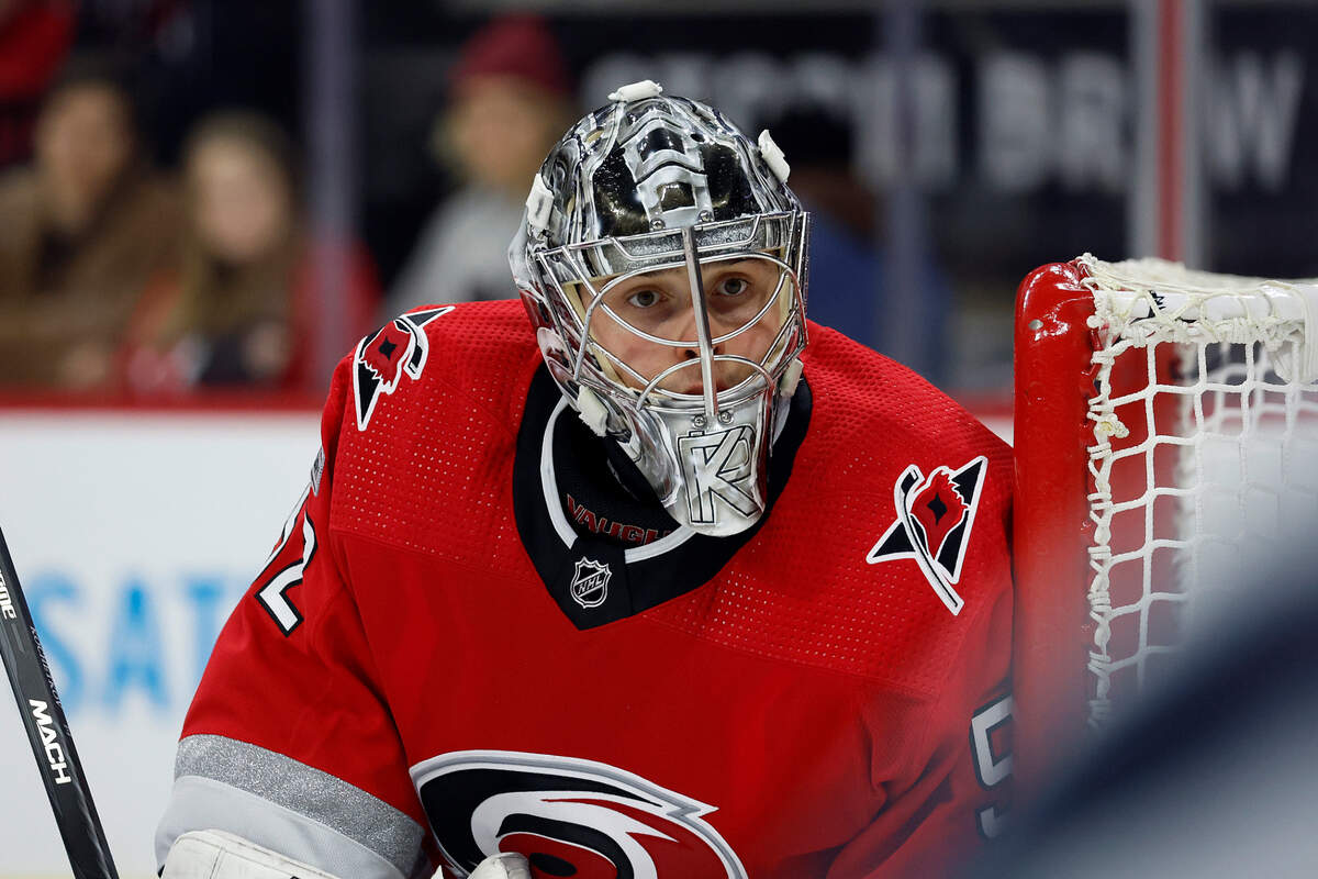 Carolina Hurricanes goaltender Pyotr Kochetkov (52) watches the puck against the Seattle Kraken during the third period of an NHL hockey game in Raleigh, N.C., Thursday, Dec. 15, 2022. (AP Photo/Karl B DeBlaker)