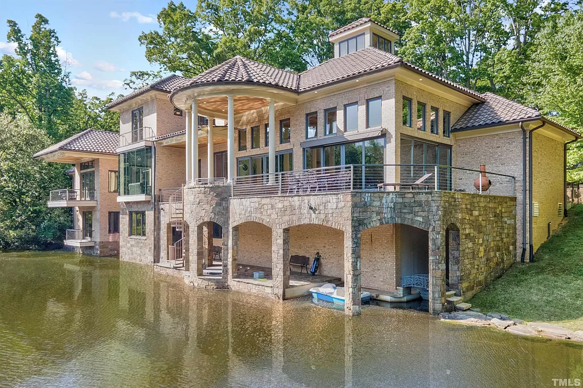 A boathouse is built into the vast home.