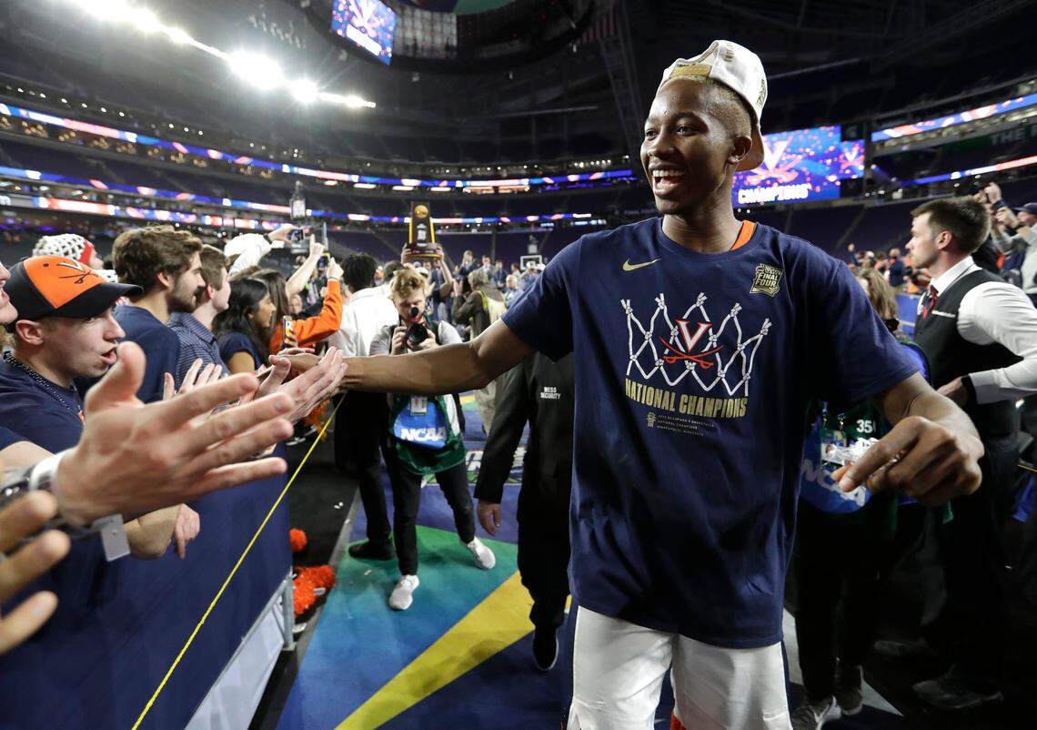 Virginia forward Mamadi Diakite celebrates with fans after the championship game against Texas Tech in the Final Four NCAA college basketball tournament, Monday, April 8, 2019, in Minneapolis. Virginia won 85-77 in overtime.