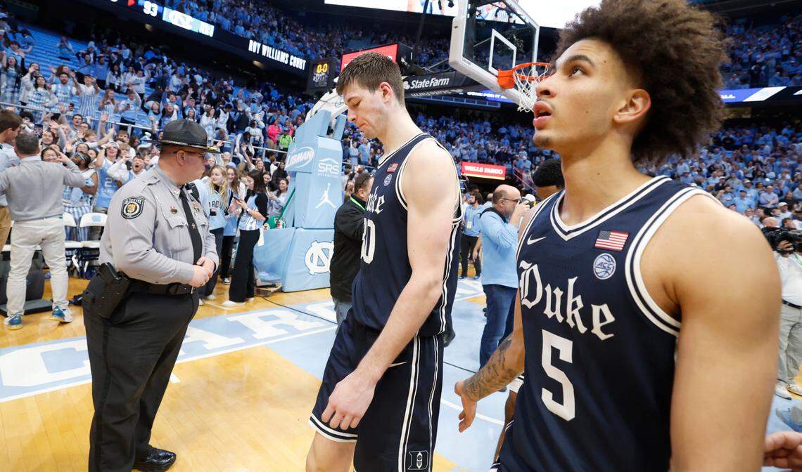 Duke’s Kyle Filipowski (30) and Tyrese Proctor (5) walk off the court after UNC’s 93-84 victory over Duke at the Smith Center in Chapel Hill, N.C., Saturday, Feb. 3, 2024.