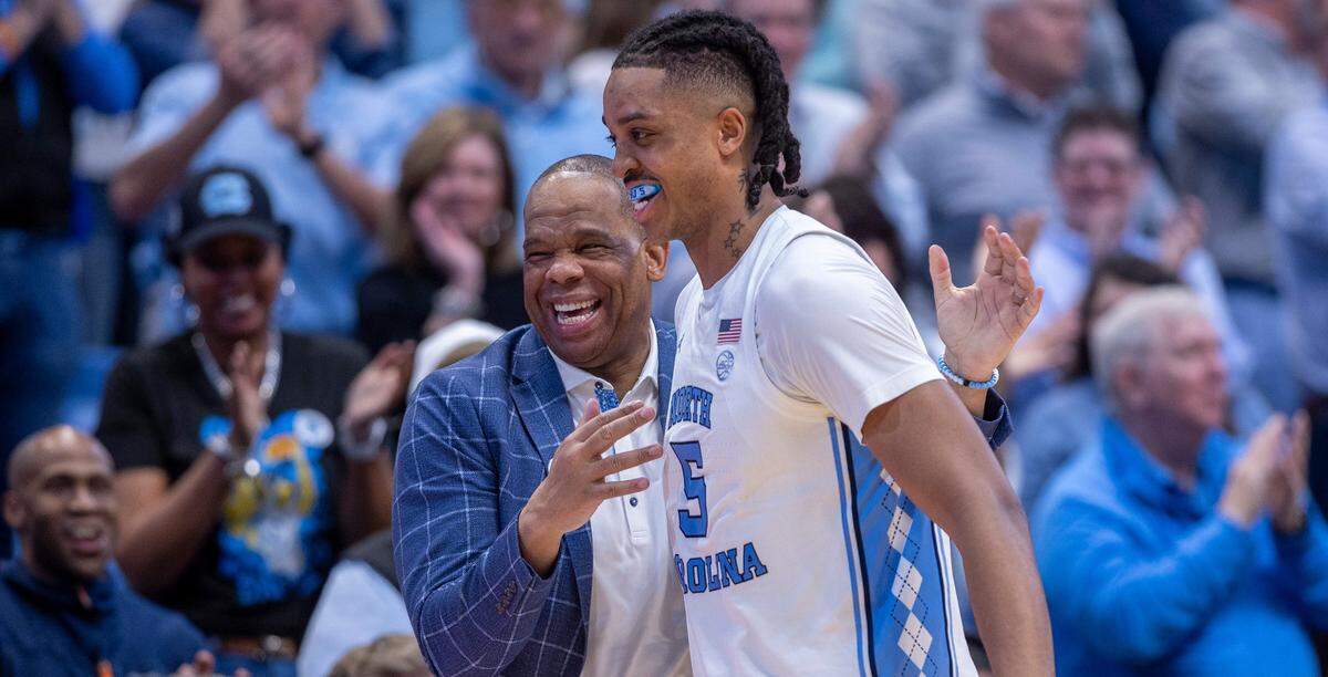 North Carolina’s Armando Bacot (5) gets a hug from coach Hubert Davis as he leaves the game with 14 points in the Tar Heels’ 84-51 victory over Noter Dame, and Bacot’s final home game on Tuesday, March 5, 2023 at the Smith Center in Chapel Hill, N.C.