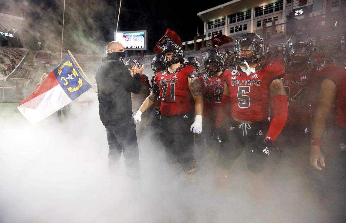 N.C. State head coach Dave Doeren prepares to lead his team onto the field before N.C. State’s game against Florida State at Carter-Finley Stadium in Raleigh, N.C., Saturday, Nov. 14, 2020.