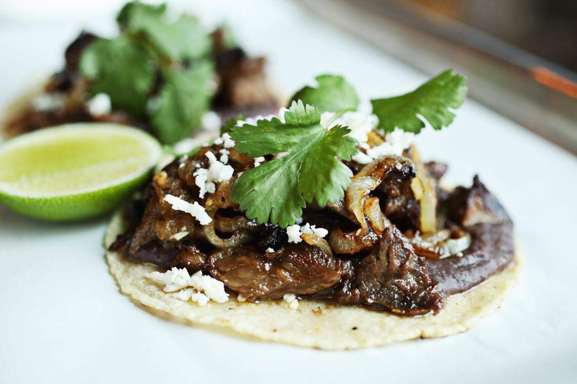Ex-Voto's carne asada is served with black bean puree, charred ranchero salsa, cogito cheese and cilantro tucked inside handmade tortillas.