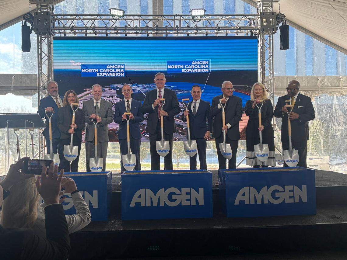 Amgen and North Carolina officials stand on stage to mark the ceremonial groundbreaking of a second Amgen facility in Holly Spring, NC on Jan. 24, 2025.